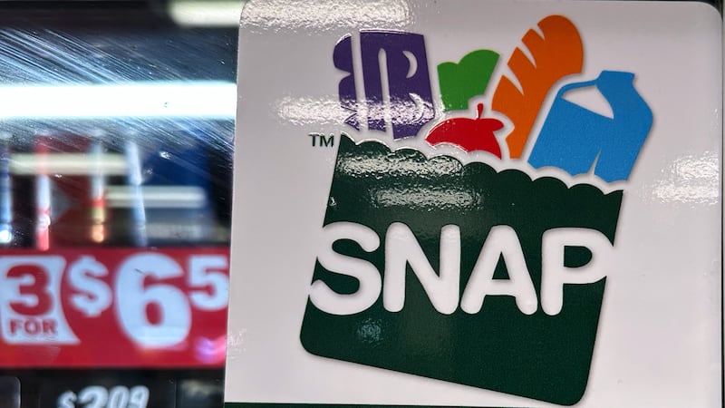 FILE - SNAP EBT information sign is displayed at a gas station in Riverwoods, Ill., Saturday,...